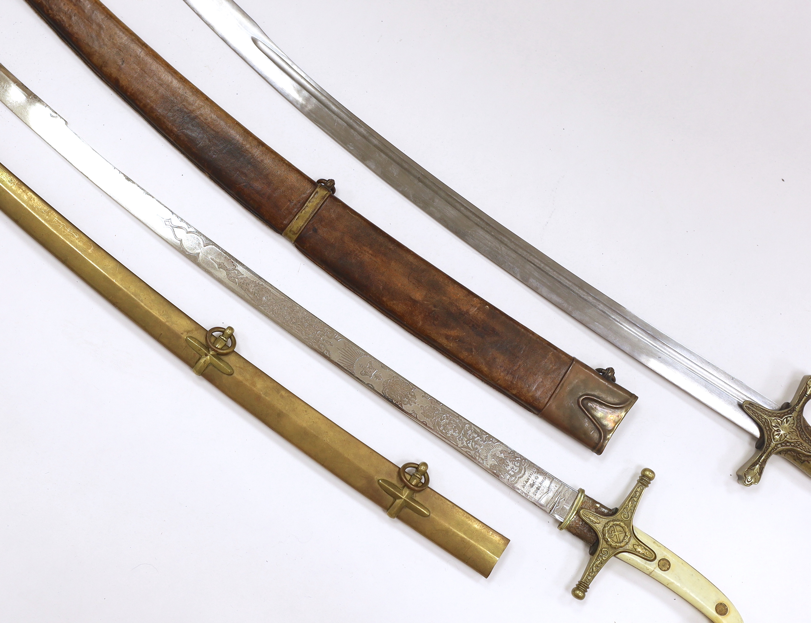 Two reproduction swords; a Victorian style naval design Mameluke sword, together with an Indian style sword, longest blade 84cm